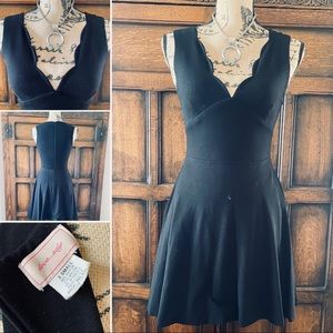 Super flattering black fit and flare mini dress.